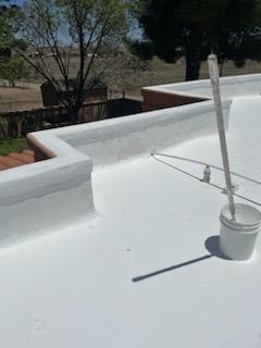 Pristine white elastomeric coating on Tucson flat roof after restoration